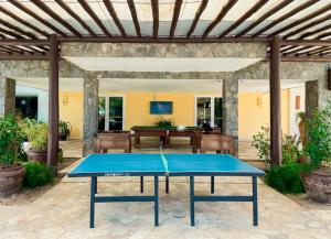 a ping pong table in the middle of a patio at Buzios Beach Resort Residencial super luxo 1307 in Búzios
