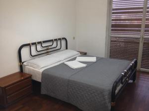 A bed or beds in a room at Star Hostel