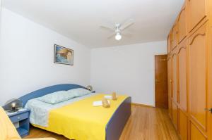 Ένα ή περισσότερα κρεβάτια σε δωμάτιο στο Apartment Andy