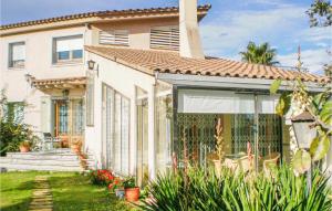 a house with a garden in front of it at Lovely Home In Santa Cristina D'aro in Santa Cristina d'Aro