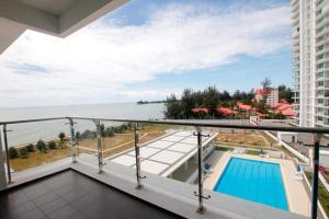 a balcony with a view of a swimming pool at Imperial Suites Miri , Diamond Tower in Miri