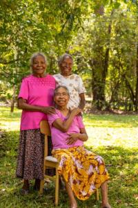 a group of three older women posing for a picture at Cooinda Lodge Kakadu in Jabiru