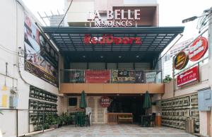 a building with a sign that reads a beijing restaurant at RedDoorz Plus at La Belle Residences Makati City in Manila