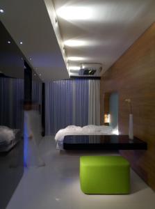 Letto o letti in una camera di i-Suite Hotel