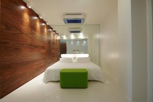 Letto o letti in una camera di i-Suite Hotel