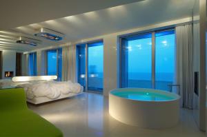 Letto o letti in una camera di i-Suite Hotel