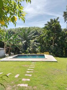 a swimming pool in the middle of a yard at Lok Mun Bungalows in Ko Yao Noi
