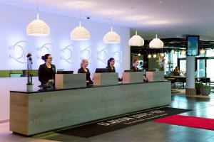 a group of people sitting at a reception desk at Clarion Hotel Energy in Stavanger