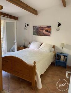 Ένα ή περισσότερα κρεβάτια σε δωμάτιο στο Maisonnette