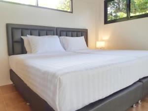 Postel nebo postele na pokoji v ubytování Villas Chaba