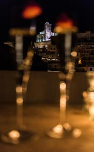 a night scene with a lit up night stand at Apartamentos Mariano in Ibiza Town