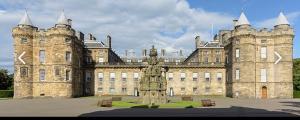 a large stone building with a statue in front of it at Ellwyn House in Edinburgh