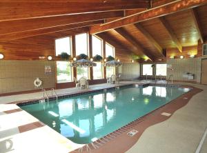 The swimming pool at or close to AmericInn by Wyndham Oswego