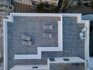 a rendering of a wall with a staircase at Bedspot Apartments Astipalaia in Pera Gyalos