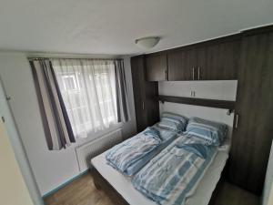 Postel nebo postele na pokoji v ubytování Aloha-Olmenduin