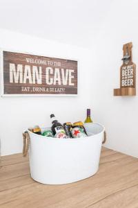 a bin filled with beer and bottles on a table at Afan Forest House - Private doubles or Twin options! Perfect for Contractors! in Port Talbot