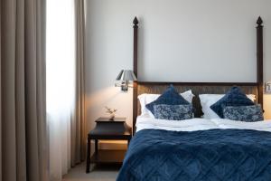 Postel nebo postele na pokoji v ubytování Elite Palace Hotel & Spa