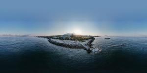 an island in the middle of a body of water at Puntaquattroventi in Ercolano