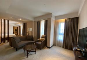 TV a/nebo společenská místnost v ubytování Lailai Hotel