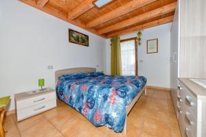 Postel nebo postele na pokoji v ubytování Albergo Diffuso Dolomiti