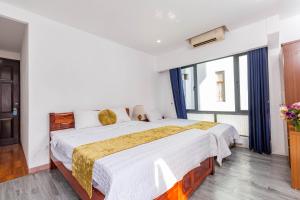 Ένα ή περισσότερα κρεβάτια σε δωμάτιο στο Hanoi View Legend Hotel