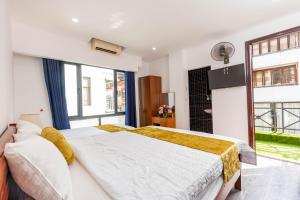Ένα ή περισσότερα κρεβάτια σε δωμάτιο στο Hanoi View Legend Hotel