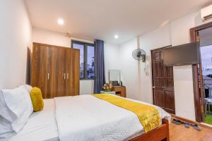 Ένα ή περισσότερα κρεβάτια σε δωμάτιο στο Hanoi View Legend Hotel