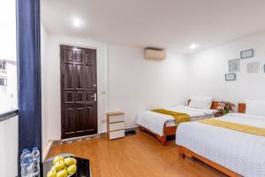 Ένα ή περισσότερα κρεβάτια σε δωμάτιο στο Hanoi View Legend Hotel