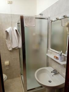 a bathroom with a shower and a sink at Hotel Degli Ulivi in Castro di Lecce