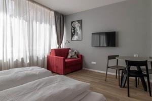 Televízia a/alebo spoločenská miestnosť v ubytovaní Apartments Iris