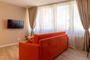 Televízia a/alebo spoločenská miestnosť v ubytovaní Apartments Iris