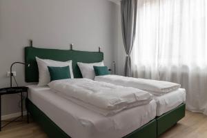 Posteľ alebo postele v izbe v ubytovaní Apartments Iris