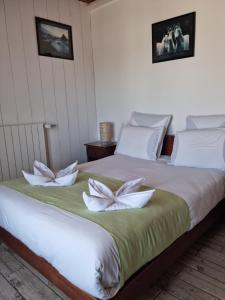 Rúm í herbergi á Hotel Des Neiges