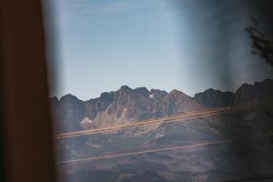 a view of a mountain from a window at Willa Szarotka in Gliczarów