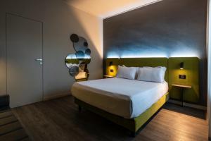 Postel nebo postele na pokoji v ubytování Hotel Mealba