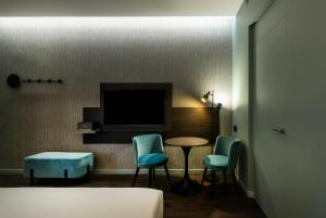 TV a/nebo společenská místnost v ubytování Hotel Mealba