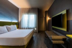 Postel nebo postele na pokoji v ubytování Hotel Mealba