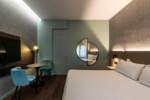 Postel nebo postele na pokoji v ubytování Hotel Mealba