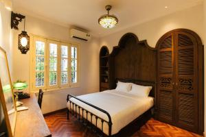 Postel nebo postele na pokoji v ubytování Tonkin House + 37 fotografií