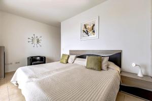 Posteľ alebo postele v izbe v ubytovaní Tenerifeopenhome Townhouse Oasis Fañabe 21 + 37 fotografií