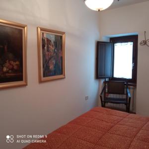 Un pat sau paturi într-o cameră la FORT Montagna Casa Impero CIR 06678CVP0002