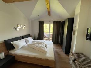 Postel nebo postele na pokoji v ubytování Penthouse Brixen