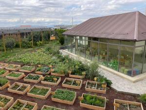an aerial view of a garden in front of a building at Green Training Center in Dzoraghpʼyur