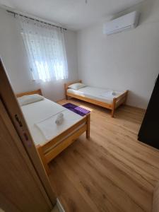 Llit o llits en una habitació de Vila Dolce Vita Mostar