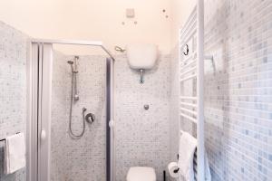 a bathroom with a shower and a toilet at B&B La veranda di Tatta in Agrigento