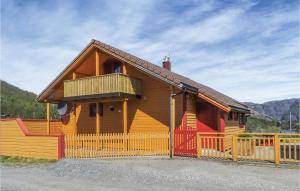 a wooden house with a fence in front of it at Lovely Home In Dirdal With Ethernet Internet in Dirdal