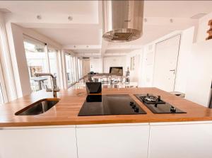 A kitchen or kitchenette at Private Pool in Villa near the Beach
