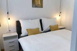 Ein Bett oder Betten in einem Zimmer der Unterkunft AAA All About Apartments