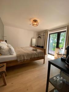 Кровать или кровати в номере Nordic Huus