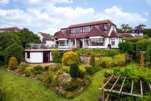 an aerial view of a house with a garden at The Spinney - Spectacular views over the bay and close to beach with parking in Paignton